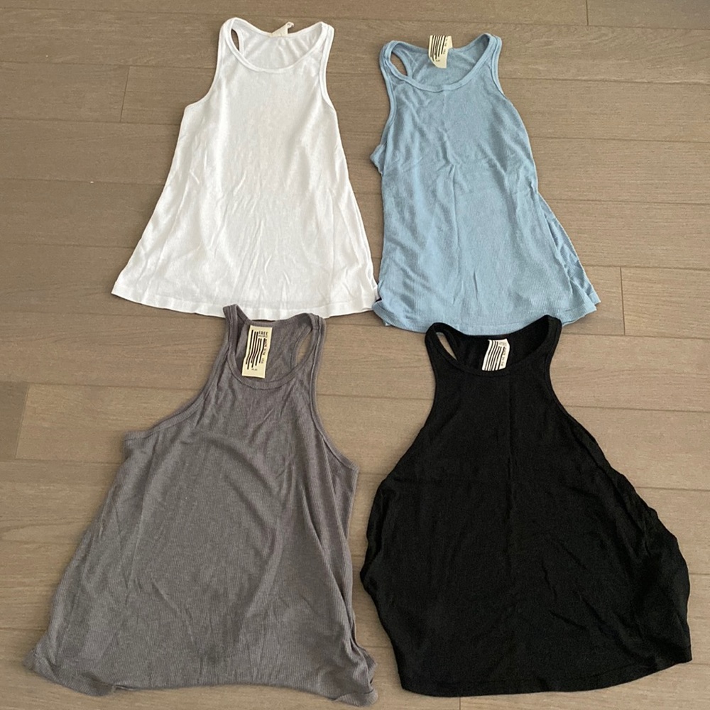 4 Free People Racerback Tanks- Sold all together for $40